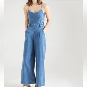 Denim wide leg jumpsuit. Open back.